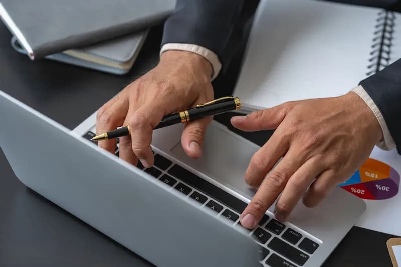 Analyst reviewing surplus lot data on a laptop